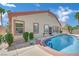 Refreshing pool with lush landscaping and inviting patio, ideal for relaxation and outdoor enjoyment at 1324 European Dr, Henderson, NV 89052