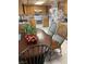 Spacious kitchen with wood cabinets, large dining area, and neutral accents at 1385 Ringe Ln, Las Vegas, NV 89110