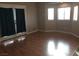 Spacious living room featuring hardwood floors, large windows, and elegant French doors at 1385 Ringe Ln, Las Vegas, NV 89110