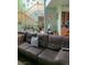 Cozy living room with a leather couch and a staircase leading upstairs at 1385 Ringe Ln, Las Vegas, NV 89110