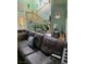 Cozy living room with a large sectional couch, staircase, and natural lighting at 1385 Ringe Ln, Las Vegas, NV 89110