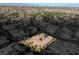 A captivating aerial view of a sprawling property with tile roofing and mature trees at 1665 Liege Dr, Henderson, NV 89012