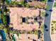 Aerial view of a luxury home showcasing a private pool and well-manicured grounds at 1665 Liege Dr, Henderson, NV 89012