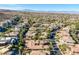 An elevated view shows mature landscaping and tile roofing in a lovely neighborhood setting at 1665 Liege Dr, Henderson, NV 89012