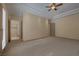 Spacious bedroom with neutral carpet, recessed lighting, and access to the bathroom at 1665 Liege Dr, Henderson, NV 89012