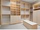 Spacious walk-in closet with custom shelving and drawers, providing ample storage at 1665 Liege Dr, Henderson, NV 89012