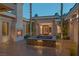Relaxing courtyard with a stylish water feature, outdoor fireplace, and inviting ambiance at 1665 Liege Dr, Henderson, NV 89012