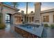 Beautiful courtyard with a cozy fireplace, spa, and seamless indoor-outdoor living at 1665 Liege Dr, Henderson, NV 89012
