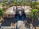 Exterior of home with palm trees and a gated entrance at 1665 Liege Dr, Henderson, NV 89012