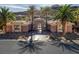 Exterior of home with palm trees and a gated entrance at 1665 Liege Dr, Henderson, NV 89012