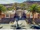 Exterior of home with palm trees and a gated entrance at 1665 Liege Dr, Henderson, NV 89012