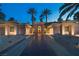 Beautiful desert home featuring a symmetrical facade, large windows, and a well-manicured yard at 1665 Liege Dr, Henderson, NV 89012