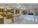 Open kitchen with large island, stainless appliances, and outdoor access at 1665 Liege Dr, Henderson, NV 89012