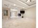 Bright living room showcases coffered ceilings, modern fireplace, and elegant tile floors at 1665 Liege Dr, Henderson, NV 89012