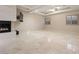 Bright living space with fireplace, recessed lighting, and tile flooring at 1665 Liege Dr, Henderson, NV 89012