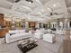 Open floor plan with a spacious living room, modern furniture, and bright recessed lighting at 1665 Liege Dr, Henderson, NV 89012