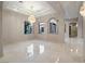 Spacious living room with marble flooring, recessed lighting, and decorative arches at 1665 Liege Dr, Henderson, NV 89012