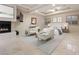 Main bedroom featuring a fireplace, sitting area, and ample natural light at 1665 Liege Dr, Henderson, NV 89012