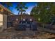Outdoor kitchen featuring built-in grill and bar area, perfect for entertaining guests at 1665 Liege Dr, Henderson, NV 89012