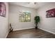Bedroom with wood floors, a ceiling fan, and a large window at 1830 N Buffalo Dr # 1031, Las Vegas, NV 89128
