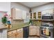 Cozy kitchen featuring granite counters, stainless steel appliances and light wood cabinets at 1830 N Buffalo Dr # 1031, Las Vegas, NV 89128