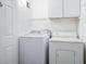 Functional laundry room area with a white washer and dryer at 1830 N Buffalo Dr # 1031, Las Vegas, NV 89128