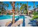 Beautiful pool area complemented by swaying palm trees, creating a serene retreat at 1830 N Buffalo Dr # 1031, Las Vegas, NV 89128
