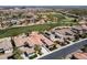 Scenic aerial view overlooking the home's manicured landscaping, and golf course at 2080 Orchard Mist St, Las Vegas, NV 89135
