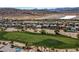 Scenic aerial view overlooking the golf course, highlighting residential neighborhood and mountain views at 2080 Orchard Mist St, Las Vegas, NV 89135