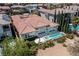 Aerial view of backyard with a pool, spa, and manicured lawn, showcasing the outdoor living space at 2080 Orchard Mist St, Las Vegas, NV 89135