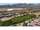 Beautiful aerial view of home on the golf course with mountain views in the background at 2080 Orchard Mist St, Las Vegas, NV 89135