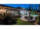 Inviting backyard featuring a pool, spa, patio seating, and manicured landscaping for entertaining at 2080 Orchard Mist St, Las Vegas, NV 89135