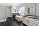 Elegant bathroom with marble accents, a soaking tub, glass shower, and marble countertops at 2080 Orchard Mist St, Las Vegas, NV 89135