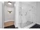 Luxurious bathroom with glass walk-in shower, stone bench and shower niche and wall mounted bison head at 2080 Orchard Mist St, Las Vegas, NV 89135