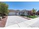 Charming single-story home featuring a tile roof, neutral stucco, arched entry, and well-manicured landscaping at 2080 Orchard Mist St, Las Vegas, NV 89135