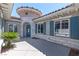 Home featuring a gray stone facade, a front turret, and blue shutters at 2080 Orchard Mist St, Las Vegas, NV 89135