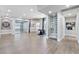 Hallway with wine cellar, art display, and view to an enclosed office and other parts of the home at 2080 Orchard Mist St, Las Vegas, NV 89135