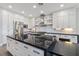 Gourmet kitchen featuring an expansive island, stainless steel appliances, and custom cabinetry at 2080 Orchard Mist St, Las Vegas, NV 89135