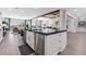 Open concept kitchen with stainless appliances, a large kitchen island, and views into the Gathering room at 2080 Orchard Mist St, Las Vegas, NV 89135