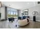 Bright, open living room with hardwood floors and a stunning view of the pool at 2080 Orchard Mist St, Las Vegas, NV 89135