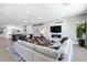 Open-concept living space with a marble fireplace and modern furnishings at 2080 Orchard Mist St, Las Vegas, NV 89135