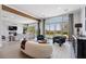 Bright, open living room with a view of a beautiful backyard and swimming pool at 2080 Orchard Mist St, Las Vegas, NV 89135