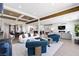 Bright and airy living room with modern furniture, hardwood floors, and coffered ceilings at 2080 Orchard Mist St, Las Vegas, NV 89135