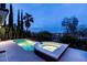 Evening view of pool and spa area with lush landscaping offers a tranquil backyard retreat at 2080 Orchard Mist St, Las Vegas, NV 89135