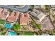 A beautiful aerial view showcasing the home's backyard with manicured landscaping and desert rock features at 2764 Leys Burnett Ave, Henderson, NV 89044