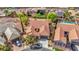 Stunning aerial view showcasing a home featuring desert landscaping, a private backyard, and a green front yard at 2764 Leys Burnett Ave, Henderson, NV 89044