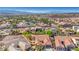 Picturesque aerial shot of a desert neighborhood with tile-roofed houses and lush green landscaping at 2764 Leys Burnett Ave, Henderson, NV 89044