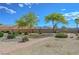 View of backyard, featuring desert landscaping, stone path, and distant mountains at 2764 Leys Burnett Ave, Henderson, NV 89044