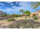 Desert landscaped backyard features a paver path, shrubs and trees at 2764 Leys Burnett Ave, Henderson, NV 89044