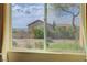 View of landscaped backyard from a sunny window with beautiful landscaping at 2764 Leys Burnett Ave, Henderson, NV 89044